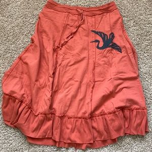 Unique appliqué melon-colored skirt